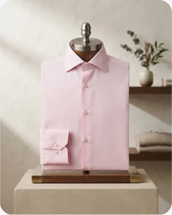 Pink shirt folded on a display block