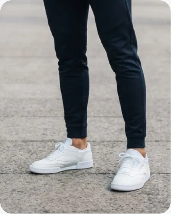 White trainers worn with slim jeans