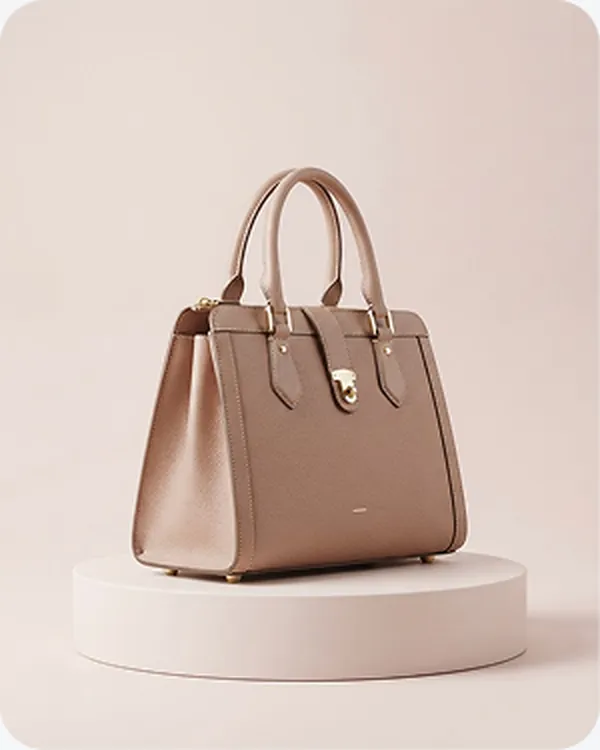 Blush leather handbag on a pedestal